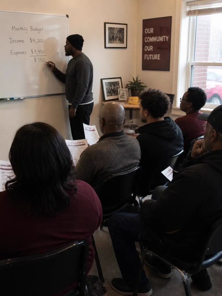 Community room workshop with attendees following printed handouts